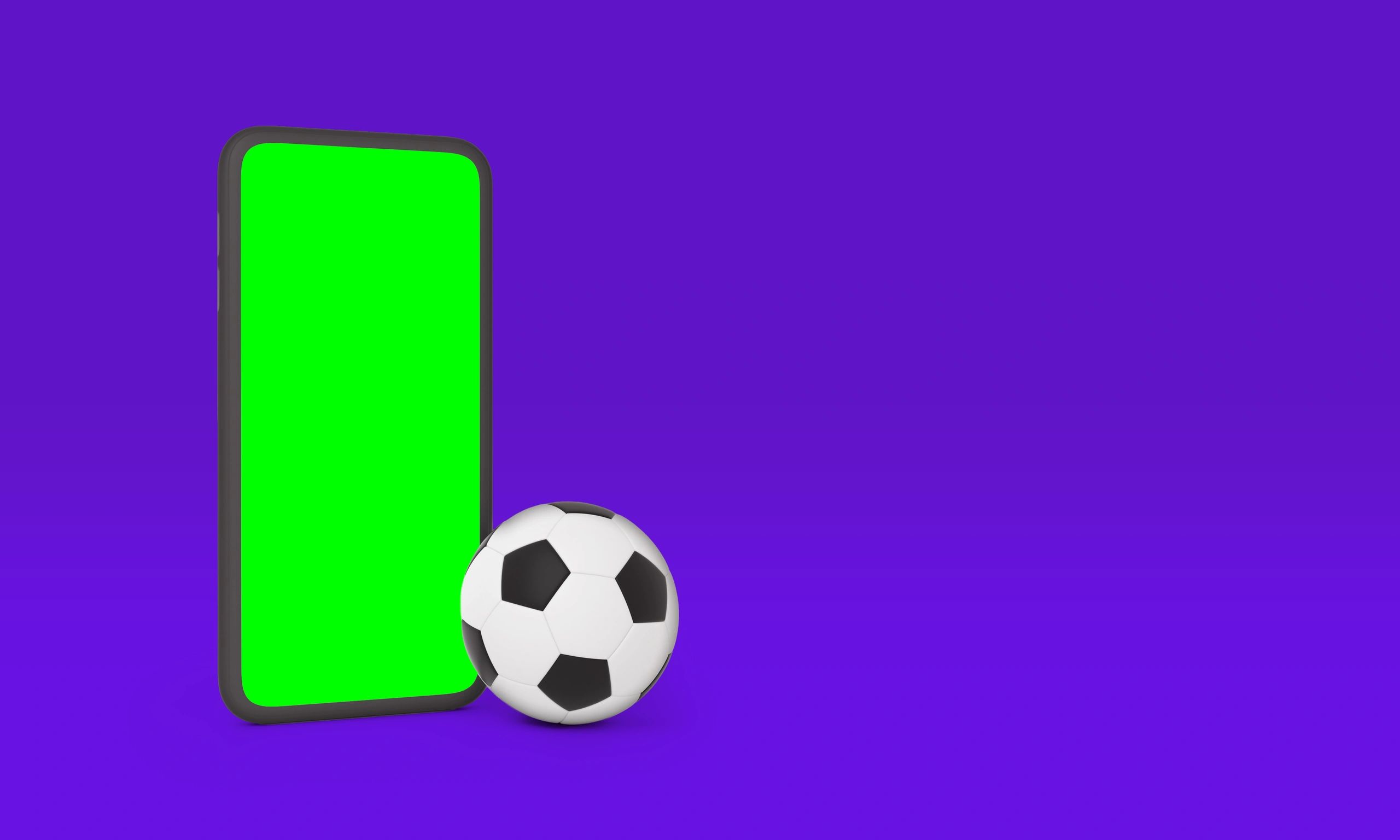 Smartphone with green screen and soccer ball on purple background
